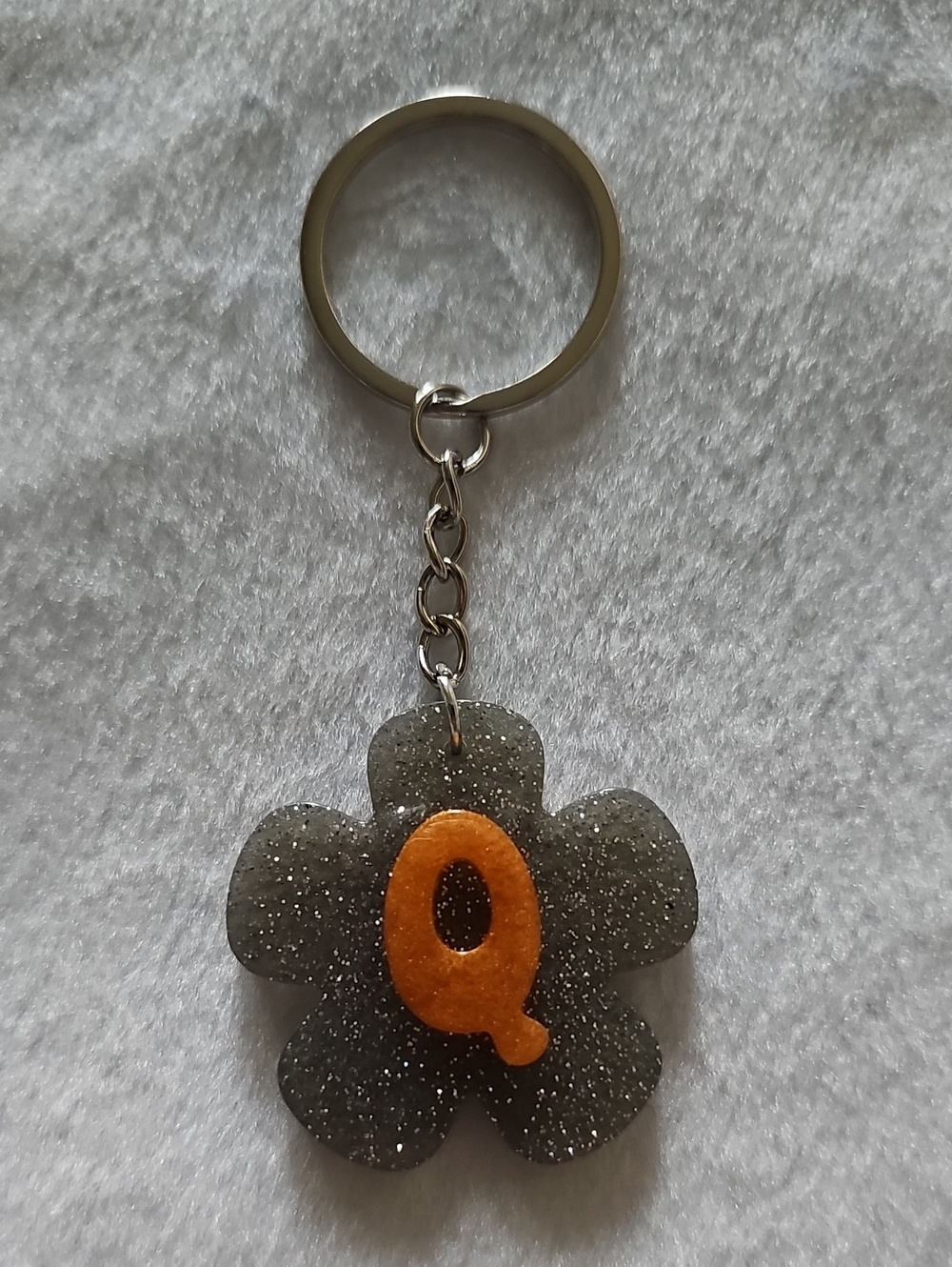 Silver Glitter Flower Keychain with Orange 'Q'